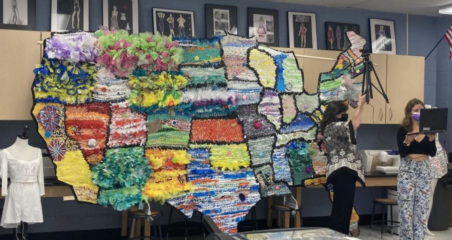 Art+teacher%2C+Mrs.+OG%2C+and+her+various+students+created+a+model+of+the+United+States+of+America+out+of+plastic+waste.+The+woven+map+will+soon+be+displayed+in+the+Commons+above+the+trophy+case.